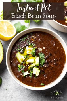 two bowls of instant pot black bean soup with avocado and cilantro