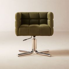 a green office chair sitting on top of a metal base with chrome legs and an upholstered seat