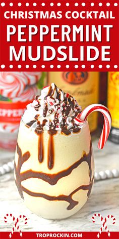 christmas cocktail peppermint mudslide in a glass with candy canes on top