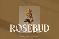 a poster with the words rosebud written in white on a brown background and an image of a woman's hand holding a rose