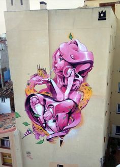 a painting on the side of a building that has been painted with pink and yellow colors