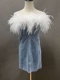 Beautiful raw edge denim mini dress with white ostrich feather trim. Make a statement with this fun feather trimmed dress! Made to order - Please allow 4-6 days for production * Sizing - All items are made according to measurement ranges, they are NOT typical letter or numeric sizing. It is imperative to compare your exact measurements with the size chart provided either in the listing photos or item descriptions and to also add your measurements under Personalization. If you have any questions on sizing, please feel free to message me. Do not order your normal size without taking and comparing measurements. * EXCHANGES ONLY. Returns will not be accepted. I have explained the importance of adding your exact measurements under Personalization and/or sending them to me so that I can help wit Crystal Dresses, Ostrich Feather Trim, Feather Jacket, Crystal Dress, Feather Tops, Feather Trim, Ostrich Feather, Feather Dress, Denim Mini Dress