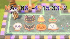 an animal crossing game with pumpkins, cats and ghost cookies on the ground in front of it