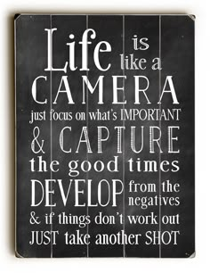 a black and white poster with the words life is like a camera