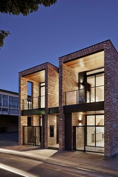 two story brick building with balconies at night