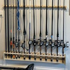 there are many fishing rods hanging on the wall