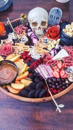 a wooden bowl filled with different types of food and snacks on top of a table