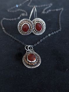 This really elegant jewelry set with faceted carnelian stones made and designed entirely by me in my home studio. I really love the museums rustic, historic jewelry collections from the ancient times, that is my main inspiration when I make my new pieces.  It is discounted by 35% to give room for new designs, but in perfect condition This carnelian set turned out really elegant, but rustic at the same time, looks good both with casual or more fancy clothes.  The jewelry set was cut out freehand Historic Jewelry, Jewelry Sets Handmade, Fancy Clothes, Carnelian Earrings, Carnelian Stone, Twisted Wire, Metal Sheet, Oxidized Sterling Silver, Fancy Outfits