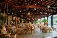 the inside of a restaurant with tables and chairs set up for an event or function