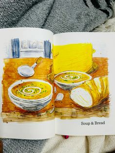 an open book showing soup and bread