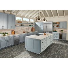 a large kitchen with gray cabinets and white counter tops