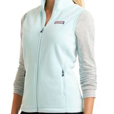 This Vineyard Vines Women's Westerly Vest Is The Perfect Holiday Gift. It's Great For Layering On A Frosty Winter Morning Or A Chilly Spring Afternoon. The 100% Polyester Polartec Fleece And Unique Wintermint Color Will Keep You Both Warm And Looking Chic. Features Zip Front Vest With Side Zip Pockets Contrast Color Locker Loops Interior Zipper And Neck Binding Signature Logo At Bottom Hem Signature Whale Pull New Without Tags -- Never Worn Color: Wintermint Size: M Light Blue Casual Outerwear For Layering, Light Blue Fitted Casual Outerwear, Preppy Must Haves, Spring Afternoon, Polartec Fleece, Winter Morning, Green Mint, Fleece Vest, Signature Logo