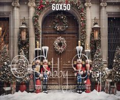 two nutcrackers are standing in front of a building decorated with christmas decorations