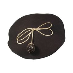 This Yves Saint Laurent Rive Gauche hat is composed of a black wool. The hat features a knit ball with metallic accents set in a bow. In excellent vintage condition. Made in France. This YSL hat is from an extensive collection I acquired from the estate of a very wealthy lady who chose to live in Paris for several decades and was determined to spend her entire fortune living luxuriously in a hotel and shopping solely at CHANEL and SAINT LAURENT. She had been a staple at the brand's fashion shows Black Berets, Paper Bag Princess, Black Beret, Leather Mask, Wool Berets, Rive Gauche, Floral Applique, Best Wear, Metallic Accents