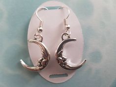 Gorgeous Celestial half moon, drop earrings. Suitable for winter solstice and all year around. There is a matching necklace Please check the listing below. https://www.etsy.com/uk/listing/648388547/celestial-moon-necklace-halloween-world?ref=listing-shop-header-2 These can be customised just message me for details. Materials Tibetan Silver Silver Plated Hooks Postage All items will be sent first class. The estimated delivery will be between 1- 3 days (UK) and out side the UK it will be 7 -14 day Handmade Adjustable Half Moon Earrings, Handmade Half Moon Earrings, Dangle Earrings With Sun And Moon Design For Gift, Silver Earrings With Sun And Moon Design As Gift, Silver Sun And Moon Design Earrings For Gift, Sun And Moon Design Dangle Earrings Gift, Sun And Moon Design Dangle Earrings For Gift, Adjustable Hypoallergenic Crescent Jewelry, Adjustable Half Moon Earrings As Gift