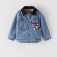 Zara | Jackets & Coats | Zara Kids Fleece Mickey Disney Jean Jacket | Poshmark Long Sleeve Outerwear With Cartoon Print For Playtime, Disney Hooded Winter Outerwear, Zara Blue Cotton Outerwear, Disney Long Sleeve Fall Outerwear, Disney Style Long Sleeve Fall Outerwear, Fall Disney Long Sleeve Outerwear, Cotton Mickey Mouse Long Sleeve Outerwear, Winter Mickey Mouse Hooded Outerwear, Denim Outerwear With Pockets For Playtime