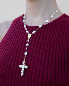 Add some heavenly style to your look with our Pearl Virgin Mary Cross Rosary. Featuring freshwater pearls and a delicate rosary and cross necklace design, this piece is perfect for daily wear or special occasions. The sparkling cubic zirconia accents add a touch of divine sparkle. Amen to that! 18k gold-plated, freshwater pearl, cubic zirconia 14" necklace | 2" extension chain | 8 mm pearls | 2" drop with 1.5" cross pendant Multiple sizes are available Handmade in Los Angeles with imported mater Cross Rosary, Necklace Design, Sticker Shop, Virgin Mary, Necklace Designs, Rosary, Cross Pendant, Stocking Stuffers, Freshwater Pearls