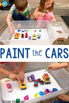 two children playing with toys in a box that says paint the cars on it and overlaid