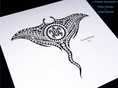 an intricate design on a white paper with black ink in the shape of a stingfish