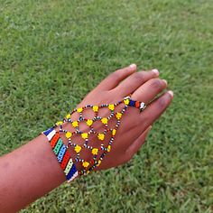 100 % Hand made. This Zulu beaded glove is also a Zulu love letter. Depending on the colors. Makes a great gift for Brides or Girlfriend. It adds a spark to any outfit. It is 8.5 inches long fits most adults . Unique Yellow Beaded Bracelets For Festival, Unique Beaded Bracelets For Festivals, Multicolor Hand Wrapped Beads For Festival, Hand-wrapped Multicolor Beads For Festival, Beaded Wristlet Gift, Beaded Gloves, Zulu Women, Zulu, African Beads