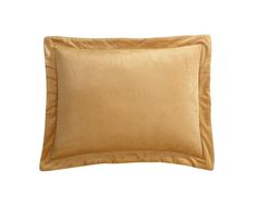 a gold pillow on a white background