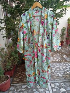 This Robe we makes from 100% Cotton printed fabric. The fabric print is Anokhi Floral which is very popular in all over the world . We use pure cotton cambric fabric . This is free One size robe . There is both side pocket in robe. Length = 120 cms. ( 48 inches) Traditional Multicolor Digital Prints For Spring, Green Cotton Dress With Digital Print, Bohemian Cotton Floral Print Robe, Bohemian Cotton Robe With Floral Print, Multicolor Cotton Robe With Floral Print, Green Floral Print Sleepwear For Home, Green Bohemian Floral Robe, Beach Cotton Nightgown With Floral Print, Green Floral Print Long Robe