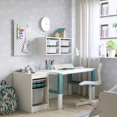 a child's room with a desk, chair and bookcase in white and blue