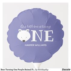 a purple foil balloon with an image of a polar bear and the words one, harper williams