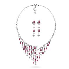 Variations:- Green Blue White Enhance your elegance with the Naurina CZ Pink Necklace Set. This exquisite piece features sparkling cubic zirconia stones paired with vibrant fuchsia pink accents, all set in a lustrous rhodium finish. Perfect for any occasion, this Indian jewelry set includes matching earrings, making it a complete statement of timeless beauty. Whether you're attending a wedding, festival, or special event, the Naurina set adds a touch of Desi jewelry charm to your ensemble. Indul Pink Diamond Necklace For Formal Occasions, Formal Pink Diamond Necklace, Elegant Pink Diamond Necklace With Accents, Elegant Pink Rhinestone Jewelry Set, Glamorous Pink Jewelry For Celebration, Elegant Pink Cubic Zirconia Necklaces, Pink Crystal Jewelry With Diamond Accents, Pink Crystal Jewelry Sets For Anniversary, Pink Crystal Jewelry Sets For Formal Occasions