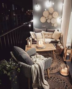 a living room filled with lots of furniture and decor on top of a wooden floor