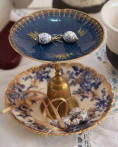 three tiered plates with blue and white designs on them