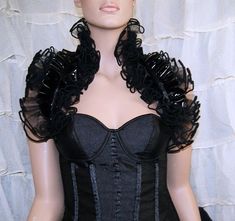 Lacy ruffles, pitch black noir, gothic formal, black tie The main fabric is a shimmery double ruffle of Pitch Black colored Bridal Tulle. Then another double ruffle of Shiny Black PVC (pleather). The edges are trimmed in contrasting Black piping. This elegant wrap is perfect for a little Formal Style. This is exactly what you need for a big event where you want to be remembered! This is such a quick way to add so much style to your evening wear. Once you get it, you are going to wonder why you w Tulle Shoulder Wrap, Formal Bolero, Gothic Formal, Evening Accessories, Hartford Ct, Satin Tulle, Shoulder Wrap, Black Pvc, Pure Black