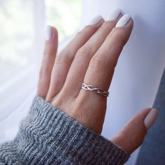 Delicate Sterling Silver Braided Ring-Beautiful, simple braid pattern -Delicate braided strands are Sterling Silver-This listing is for a single ring only. See photos for styling options-Please select size when orderingContact us with any questions about sizing or materials before ordering! Please see our FAQ section for shop policies, info on refunds/exchanges, and processing times. Please, message us with any questions!Copy/paste this link in your browser to join our VIP list for 10% off your Silver Braided Ring, Simple Braid, Triple Band Ring, Rope Ring, Celtic Ring, Silver Flower Ring, Woven Ring, Rope Rings, Braid Patterns