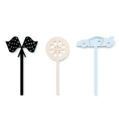 three different types of cake toppers in various shapes and sizes with bows on them