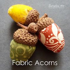 three fabric acorns are sitting on a table with the words fabric acorns written below them