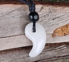 All Postage From My Shop Is My Own Discounted Track And Trace Registered Post Price With Tracking Number Emailed To Customer When Shipped. Handmade White Jade Japanese Shinto Magatama  Protection  Pendant, Will come with a free strong fully adjustable waxed cord that will fit any size neck, so you can choose it to be a choker or necklace. Pendant Length 30.mm  Pendant Width 18.mm Hand Drilled Black Wooden Bead The Magatama Shinto talisman  symbolizes "avoidance of evil" or the "magic of good for Handmade White Jewelry With Waxed Cord, White Necklace With Adjustable Waxed Cord, White Waxed Cord Necklace - Perfect Gift, White Waxed Cord Necklace For Gift, Protection Pendant, Pad Bag, Styles Ideas, Personal Protection, Choker Pendant