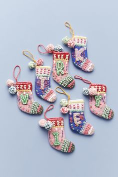 six christmas stockings ornament ornaments on a blue background