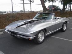 a silver sports car parked in a parking lot