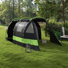 an outdoor tent set up in the grass