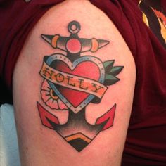 an anchor and heart tattoo on the arm