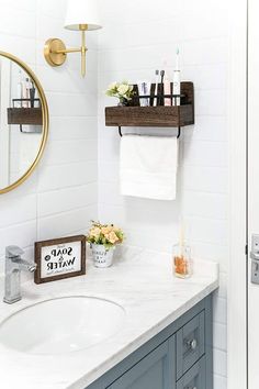 a bathroom sink with soap and water on the shelf above it next to a mirror