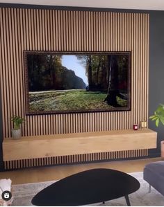 a living room with a large flat screen tv mounted on the side of a wall