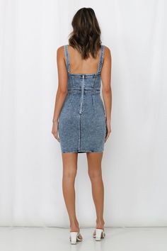 Length from shoulder to hem of size S: 79cm. Medium blue wash denim dress. Non-lined. Cold hand wash only. Model is a standard XS and is wearing size XS. True to size. Slightly stretchy and soft woven denim fabric. Silver-toned back zipper. Wash finish may vary. Cotton/Polyester. We saw your recent searches babe! Since you loved our denim One For The Money Midi Dress, we've cropped the hem to give you the reinvented mini, the Kick Up A Fuss Dress. This fitted and booty popping mini is half the effort but twice as hot! It features a classic square neckline with panelled seam details throughout, and finished off with a vintage blue wash hue. Style with a bold lip colour and statement heels.