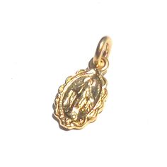 This is the smallest size of Mother Mary pendant what I have. I guarantee gold purity over 99.8%. If customer want to bigger size of Miraculous pendant, please visit my own webstore then I can make all different size and different gold weight. 14k and 18k gold are available. If you want lower cost and no tax, Please visit my local webstore. *Material :24K pure Gold(hall-marked, 99.9% ) *Weight: 24k:about 1.6gram, 14k: about 0.8gram *16mm x 7mm with bail *Chain is not included * Authorized Gem Ce 14k Gold Spiritual Miraculous Medal Jewelry And Charms, 14k Gold Spiritual Miraculous Medal Jewelry, 14k Gold Miraculous Medal As Gift, 14k Gold Miraculous Medal As A Gift, Spiritual 14k Gold Charms, Gold Oval Pendant Spiritual Jewelry, Gold Spiritual Charms And Jewelry, Yellow Gold Miraculous Medal As Gift, Spiritual 14k Yellow Gold Charms