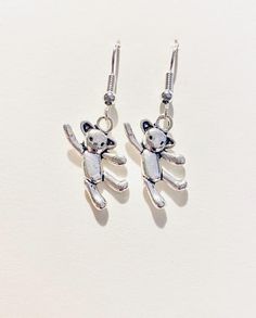 🧸Silver Teddy Bear Earrings 🧸 🧸Adorable Design:  These charming earrings feature a miniature teddy bear, perfect for adding a touch of whimsy and nostalgia to any outfit.    🧸High-Quality Material: Silver 925 ear wires, these earrings are durable and hypoallergenic, making them suitable for everyday wear.    🧸Versatile Style: Whether you're dressing up for a special occasion or simply want to add a playful element to your casual look, these teddy bear earrings are a versatile choice. 🧸Perf Teddy Bear Earrings, Earrings Funny, Aesthetic Earrings, Funny Earrings, Silver Bear, Bear Earrings, Earrings Aesthetic, Earrings Cute, Cute Earrings