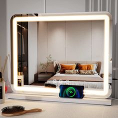 a mirror that is reflecting a bed and a brush on the floor in front of it