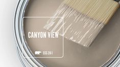 a paint can with a brush in it and the words canyon view painted on it