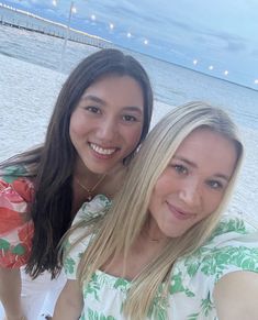 two women taking a selfie on the beach