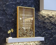 this house runs on love, laughter and wine framed cork board sign with glass goblet