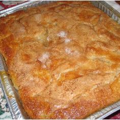 a square cake sitting on top of a metal pan